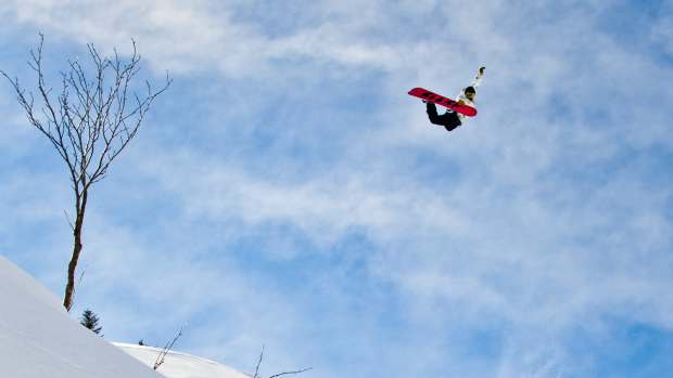 Snowboarder Manuel Diaz does a method air in Portes Du Soleil, Switzerland
