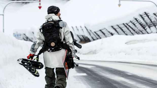 Snowboarder Torstein Horgmo walking in Hokkaido, Japan